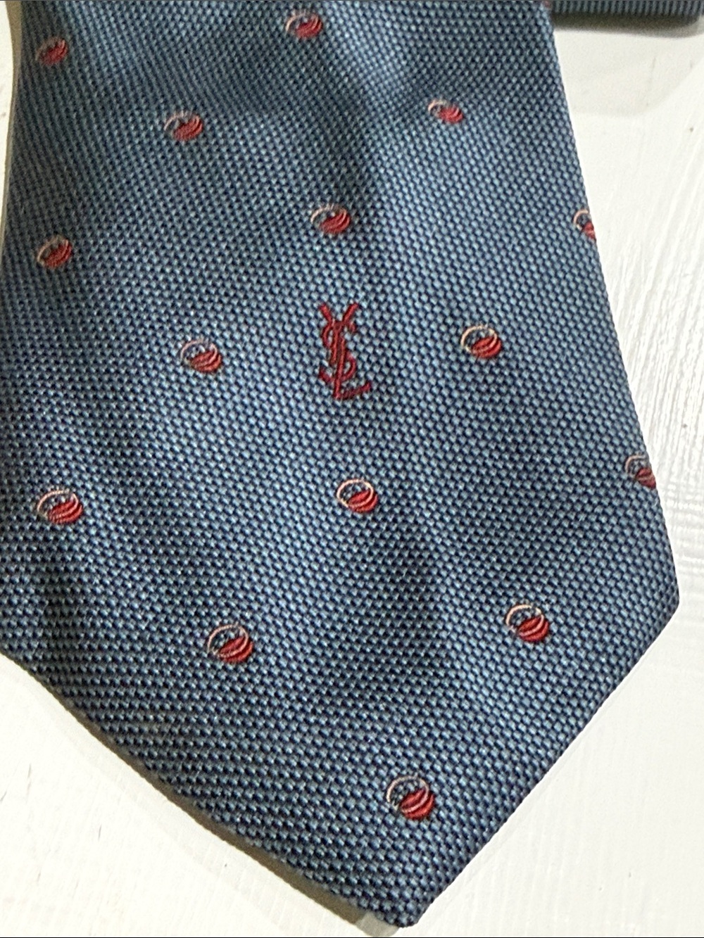 Vintage 1960โs Skinny Yves Saint Laurent Blue Textured Silk Tie with Red Motif